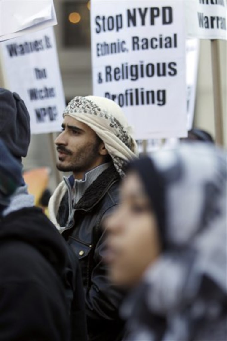 People from New York's Muslim community chant slogans during a rally in Foley Square, Friday, Nov. 18, 2011, in New York. Hundreds of Muslims gathered in lower Manhattan on Friday to pray and march in protest against a decade of New York Police Department spying on Muslim communities. (AP Photo/Mary Altaffer)